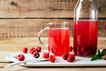kissel of raspberry, Russian traditional drink, national cuisine, fresh berries, rural style, wooden background