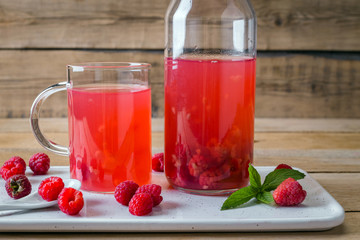kissel of raspberry, Russian traditional drink, national cuisine, fresh berries, rural style, wooden background