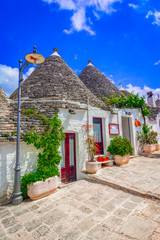 Alberobello, Puglia, Italy: Typical houses built with dry stone walls and conical roofs, in a...