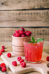 kissel of raspberry, Russian traditional drink, national cuisine, fresh berries, rural style, wooden background