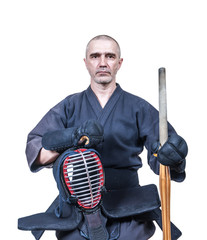 swordsman dressed in  protective equipment 'bogu' with bamboo sword 'sinai'  for Japanese fencing Kendo training