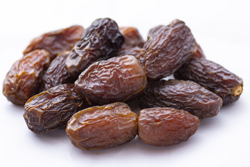 dried dates on a white background
