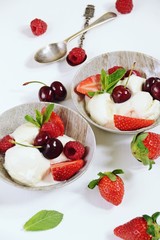 Vanilla ice cream with berries isolated. Ice cream bowl with cherry, raspberry and strawberry