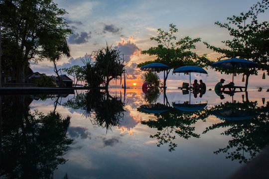 Perfect sunset reflection in the resort ifinity pool