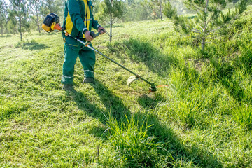 Grass cutting with a hand power tool