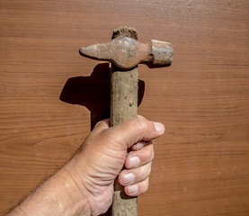 Old hammer in hand