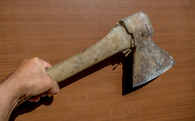 Old ax in hand