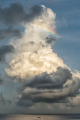 Cumulus cloud with rainbow in maldives