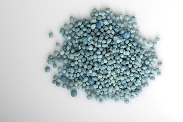 Heap of mineral fertilizers, isolated on the white background