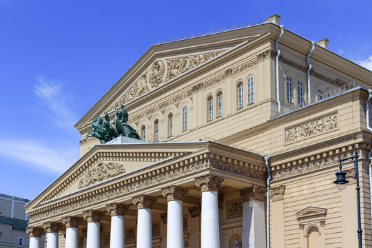 Facade of Bolshoi Theatre closeup on a blue sky background on a sunny summer morning