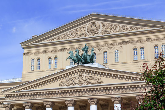 Facade of Bolshoi Theatre on a blue sky background on a sunny summer morning