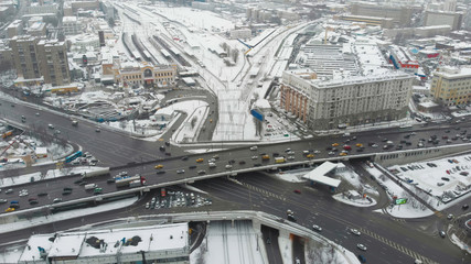 Moscow cloudy day aerial shot above high load traffic cross junction. 