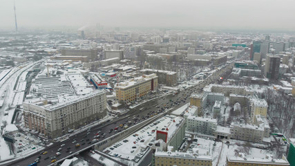Moscow cloudy day aerial shot above high load traffic cross junction. 