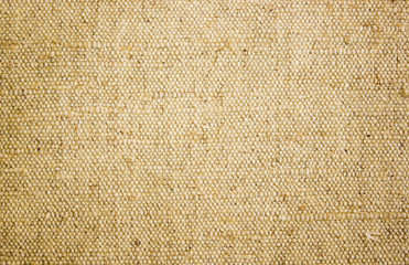Rough canvas yellow canvas. Texture of coarse cloth, burlap