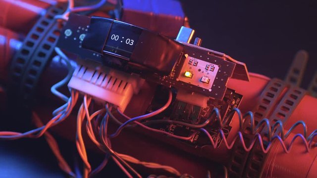 Closeup shot of a timer installed on a dynamite bomb.