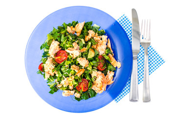 Salad and green leaves and fish