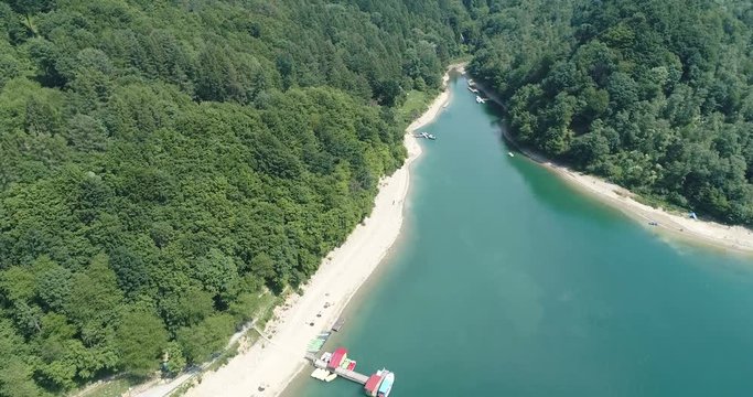 Flight over summer Solina Lake in Polish Bieszczady Mountains