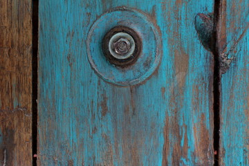 Turquoise recycled wood texture background a little worn with bolt detail