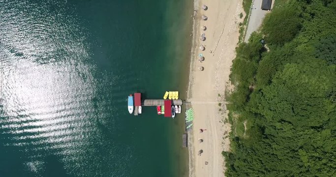 Flight over marina and beach at Solina Lake in Polish Bieszczady Mountains
