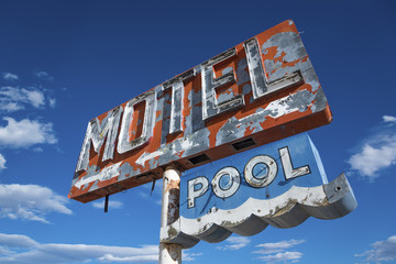 A dilapidated, classic, vintage motel sign in the desert of Arizona