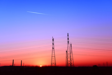 Fototapeta premium High piezoelectric towers, in the setting sun