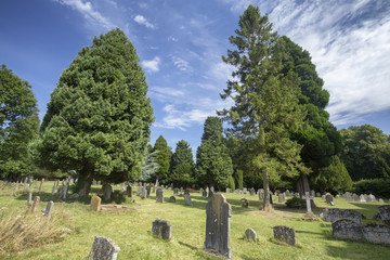 Fototapeta na wymiar Beautiful summer day in the cemetery of the Saxon Sanctuary Church in Wootton Wawen, England.
