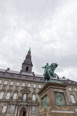 Fototapeta na wymiar Portrait view of Frederik VII and Christiansborg Palace in Copenhagen, Denmark.