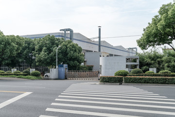 Factory building in the suburbs, industrial plant background