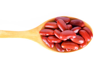 Red beans isolated in wood spoon on white background