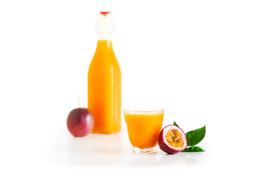 Passion fruit and passion fruit juice In a glass White isolated background 