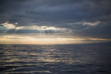 Sun rays from clouds over Bali sea
