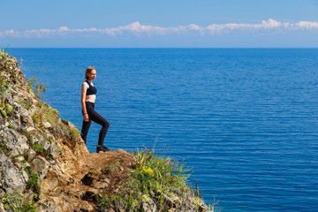 A girl in black clothes at Baikal lake