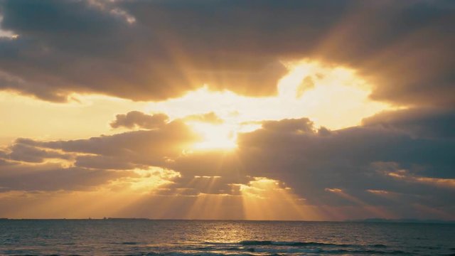 Hi Speed Flare Sun Light before hide after Cloudy before sunset on the ocean