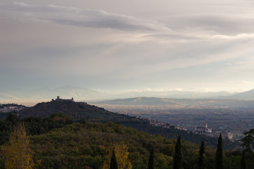 Fototapeta premium View of Assisi town from behind, with Francis church and Fortres