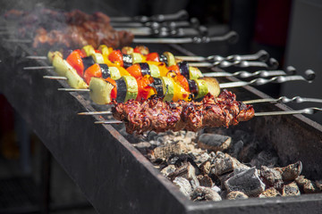 Shish kebab from vegetables on a brazier