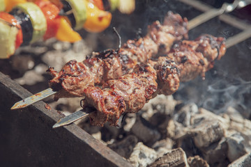 Shish kebab from beef meat on grill