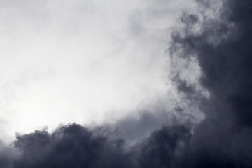 Fototapeta na wymiar Light in the Dark and Dramatic Storm Clouds background