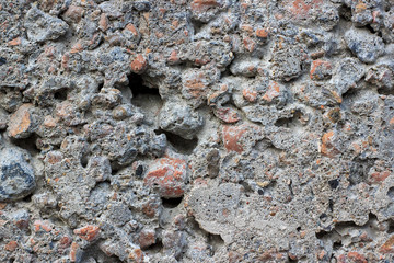 Gray concrete background with stones. Texture or background.