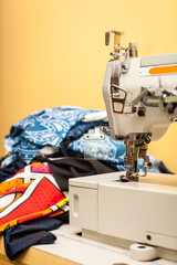 Close-up of modern sewing machine foot with copy space. Focus on needle