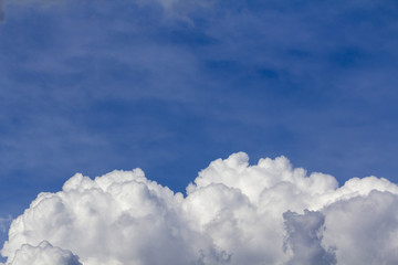 Naklejka na ściany i meble White cloud on a clear blue sky