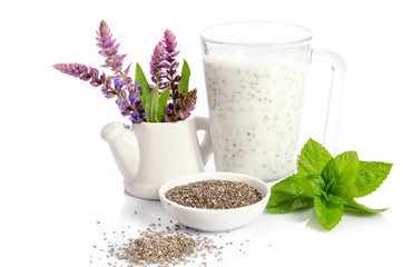 healthy breakfast : yogurt with chea seeds, mint leaves and  salvia flowers isolated on white