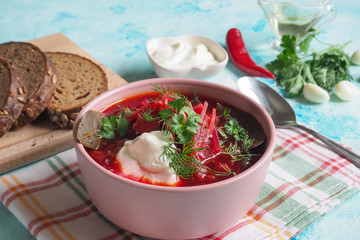 Traditional Ukrainian Russian borscht with white beans on the bowl. 