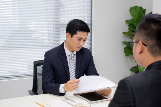 Job interview of two business professionals. Greeting new colleague