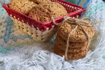 Fototapeta premium Cookies with sesame and sunflower seeds on plaid. Healthy eating