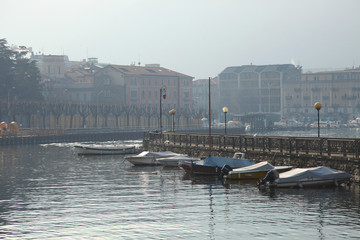 Boats at the pier at Lake Como at dawn