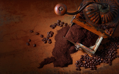 coffee ground and in grains. Old coffee grinder.