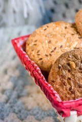 Savory cookies sprinkled with sesame seeds, sunflower on textile plaid