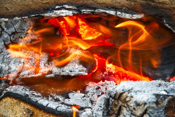 Campfire, burning wood at a tourist campsite