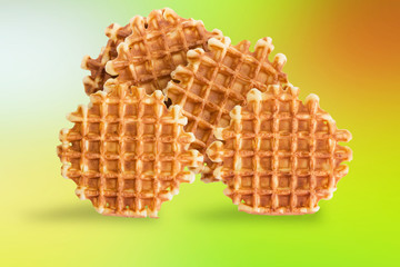 Soft waffles, sweet pastries, on a light background background, close-up, top view
