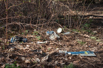Naklejka na ściany i meble Garbage pollution in the forest
